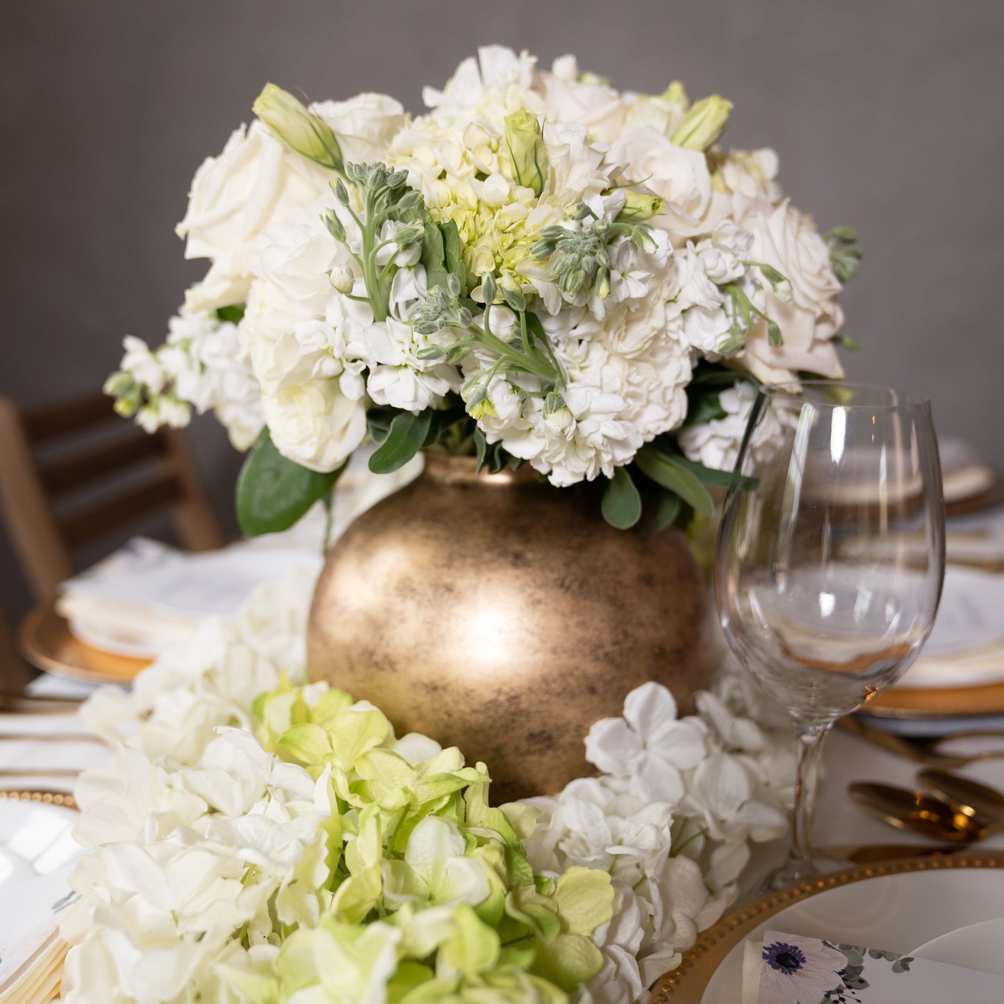 round gold metal flower vase