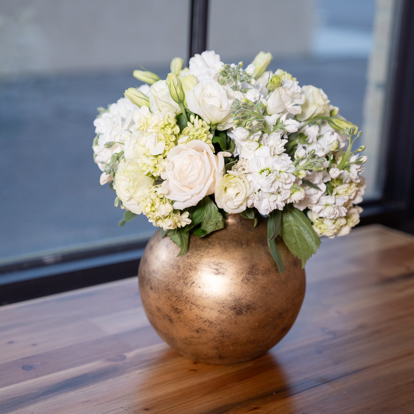 round gold metal flower vase