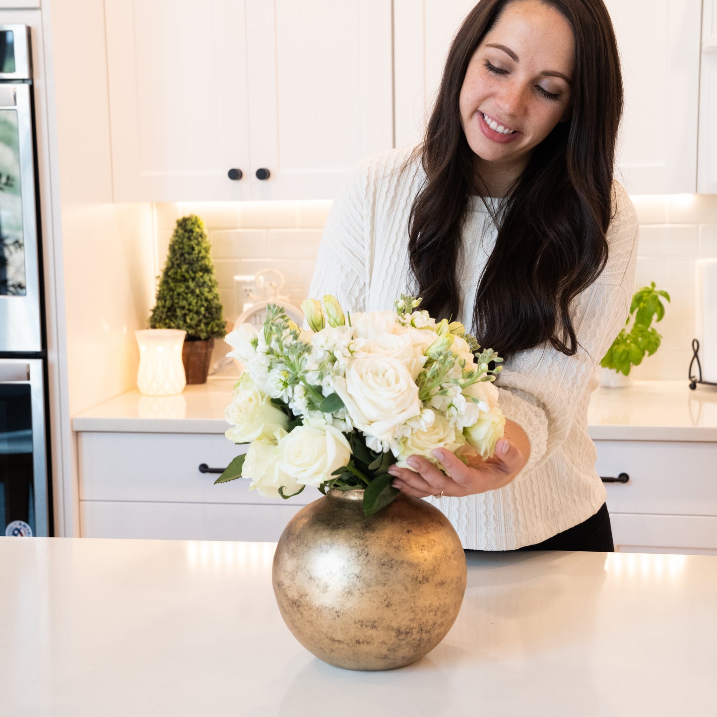 round gold metal flower vase